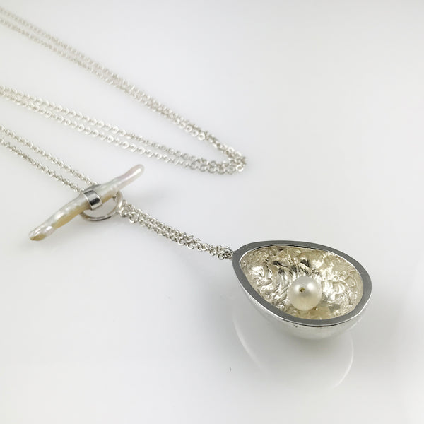 Silver egg pendant with pearl and pearl clasp