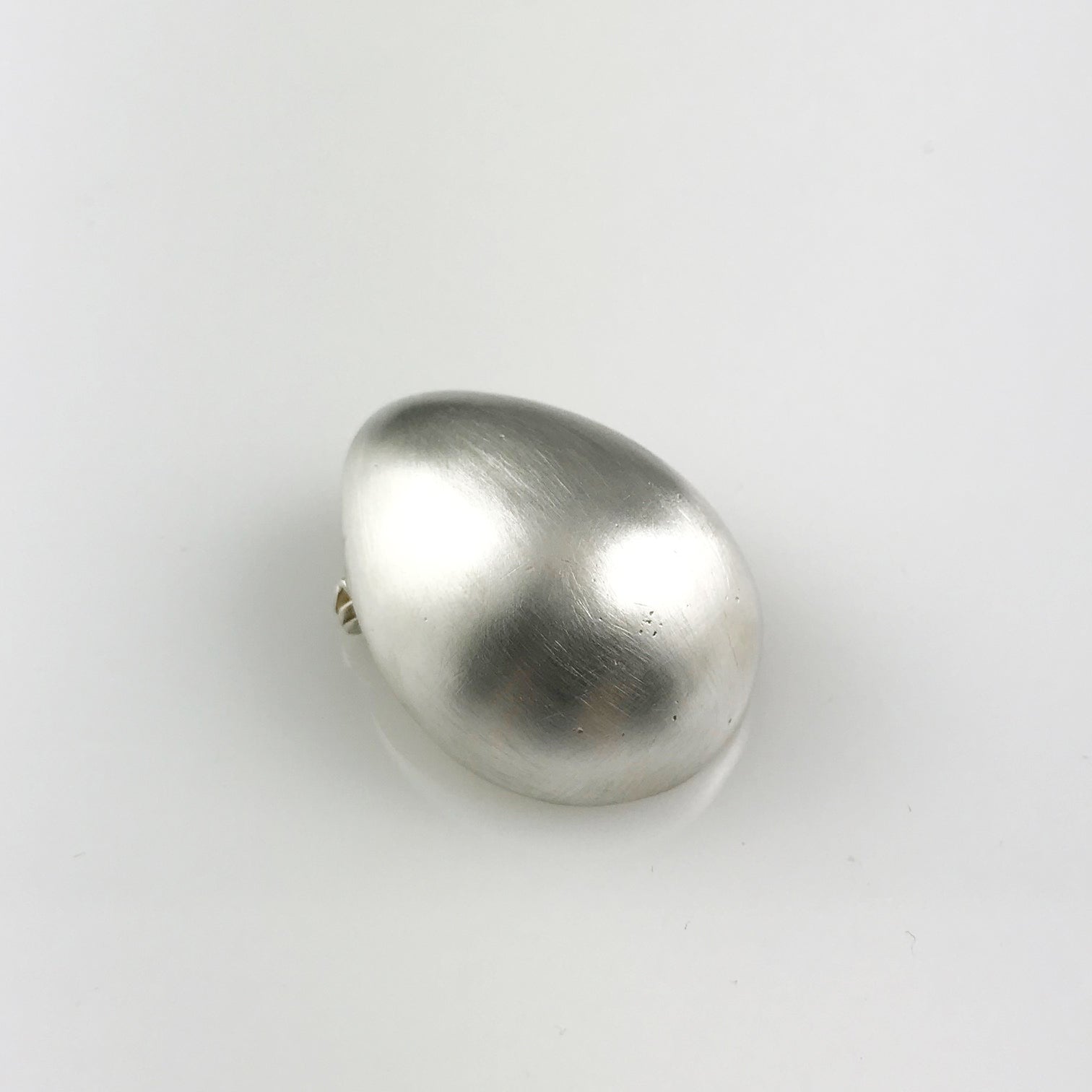 Silver egg brooch
