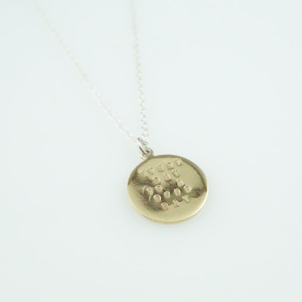 'Every day is a good day' - small silver round disc pendant with wording 'every day is a good day'