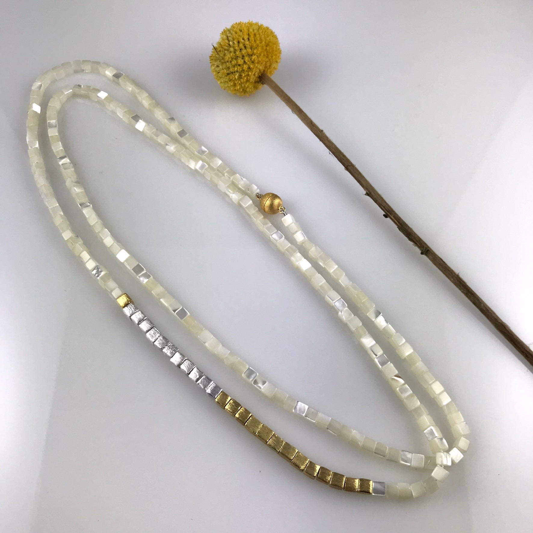 Long square shaped mother of pearls necklace with gold and silver beads