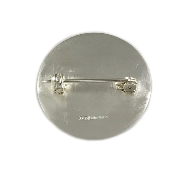 'Every day is a good day' - large round silver brooch with wording 'every day is a good day'