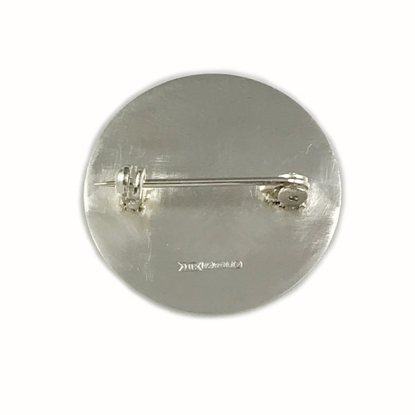 'Every day is a good day' - large round silver brooch with wording 'every day is a good day'