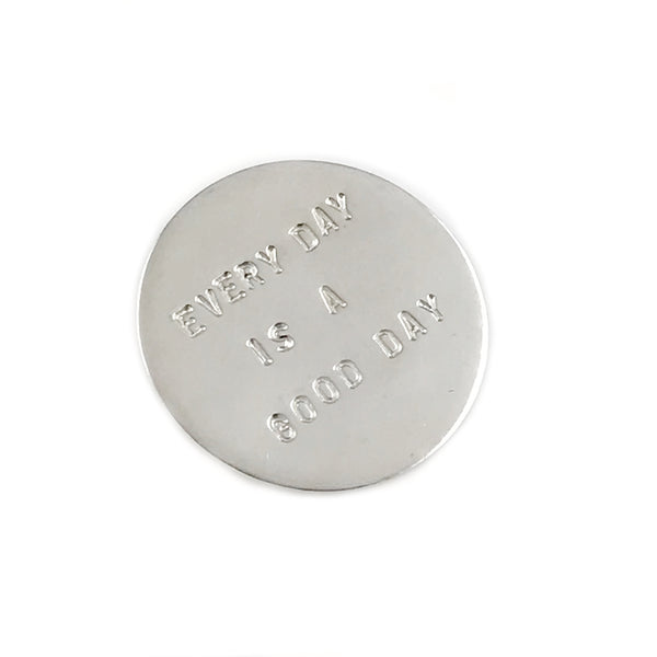 'Every day is a good day' - large round silver brooch with wording 'every day is a good day'