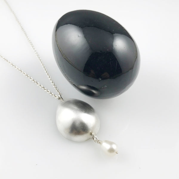 Silver egg pendant with pearls
