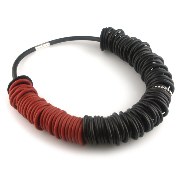 Black and red rubber necklace with one silver ring