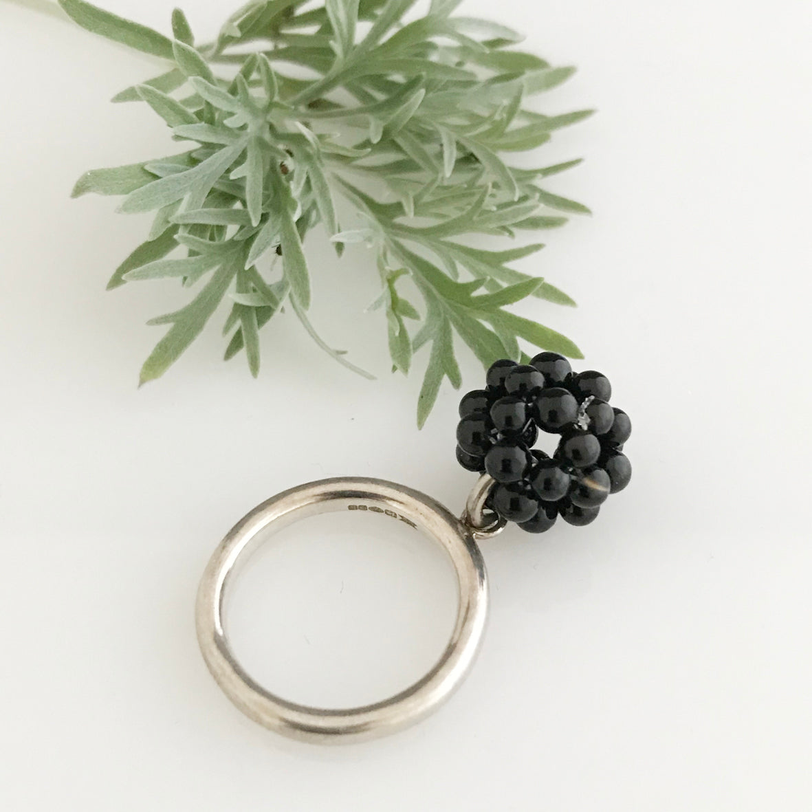 Silver ring with the cluster of onyx