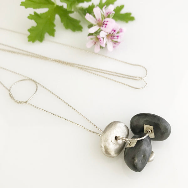 Silver necklace with silver and black porcelain stone shaped components