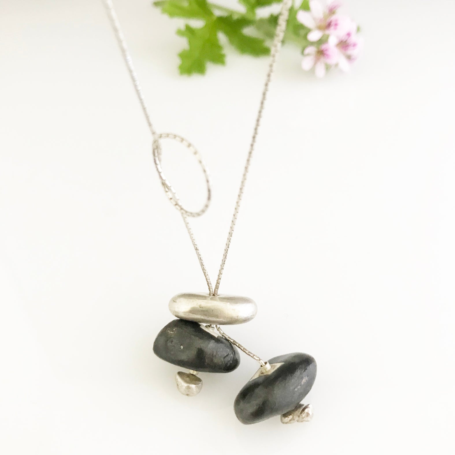 Silver necklace with silver and black porcelain stone shaped components