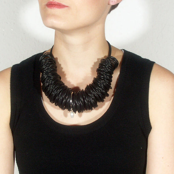 Black rubber necklace with silver ring and pearl