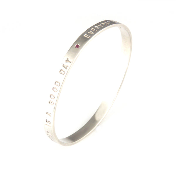 'Every day is a good day' - silver oval shape bangle with ruby