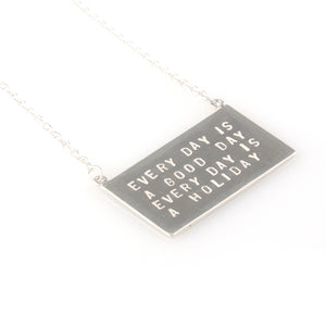 'Every day is a good day' - silver pendant with wording 'every day is a good day'