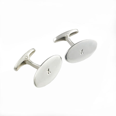 'X collection' - oval shaped silver cufflinks with words 'X' and 'X'