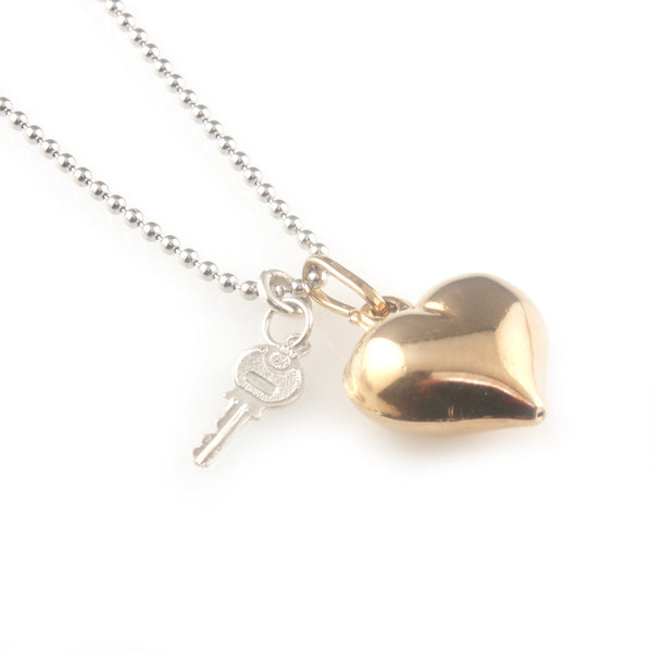 'Key to your heart' - rose gold heart and silver key necklace