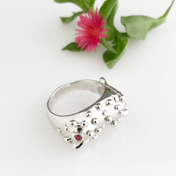 Silver ring with ruby and silver droplet