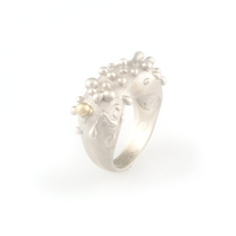 Silver ring with gold droplet