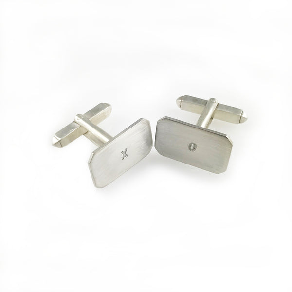 'X collection' - silver cufflinks with words 'X' and 'O'
